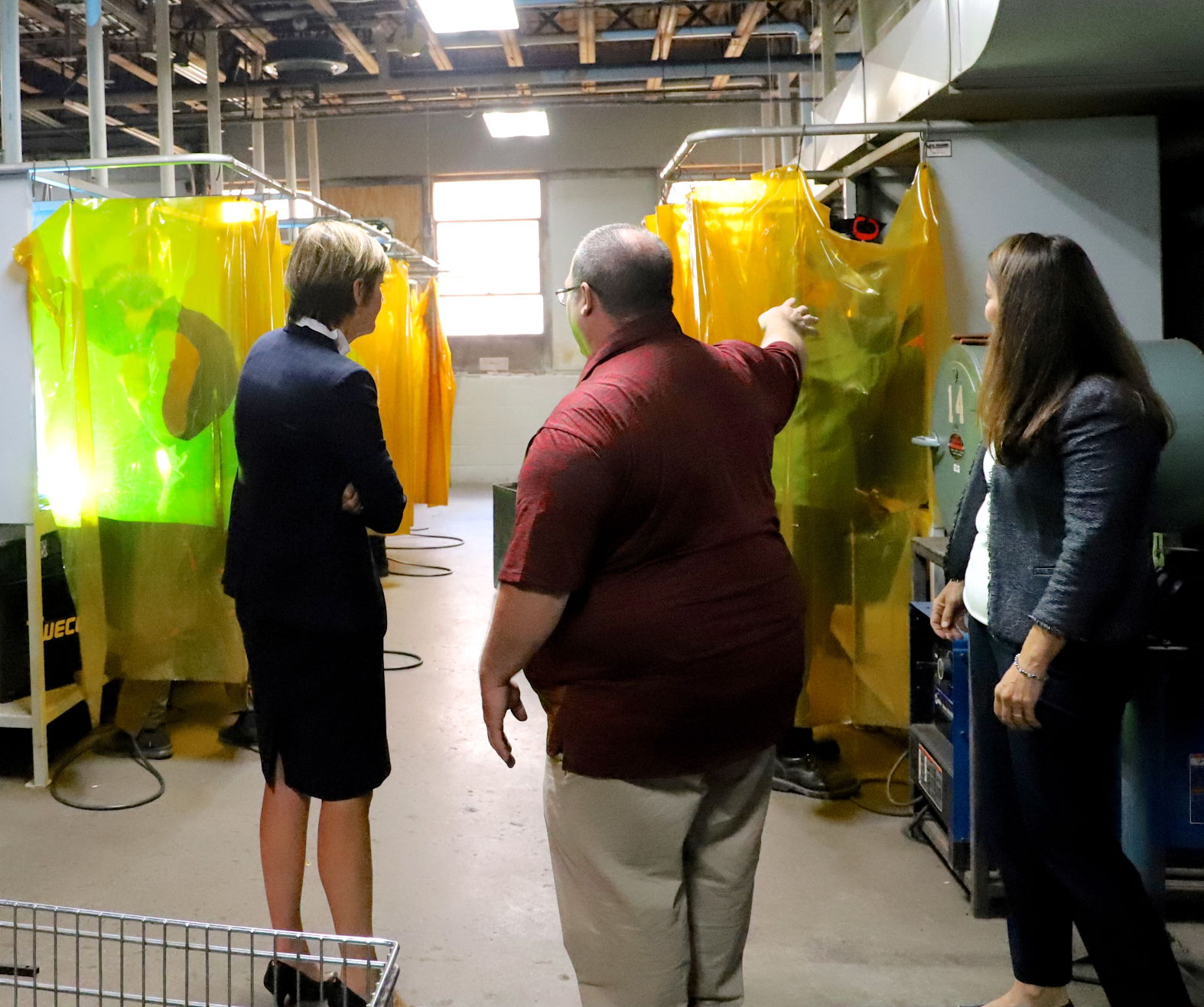 Iowa Gov. Kim Reynolds, Industrial Tech Teacher Ted Lamb, Sen. Chris Cournoyer
